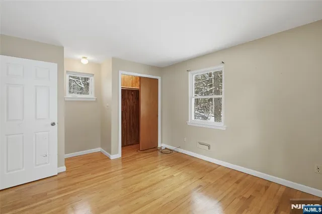 a view of a patio with a table and chairs