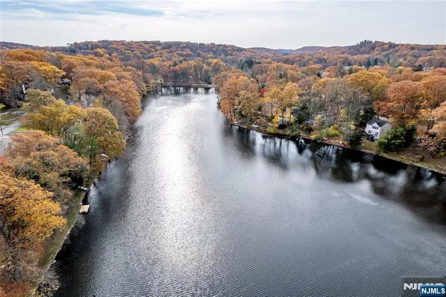 a kitchen with stainless steel appliances granite countertop a refrigerator and a stove