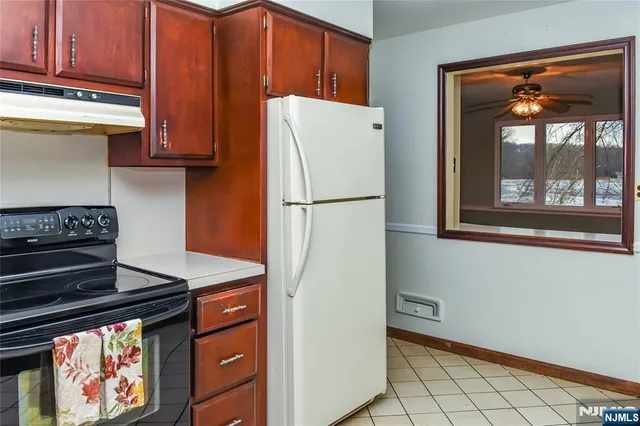 a view of an empty room and wooden floor