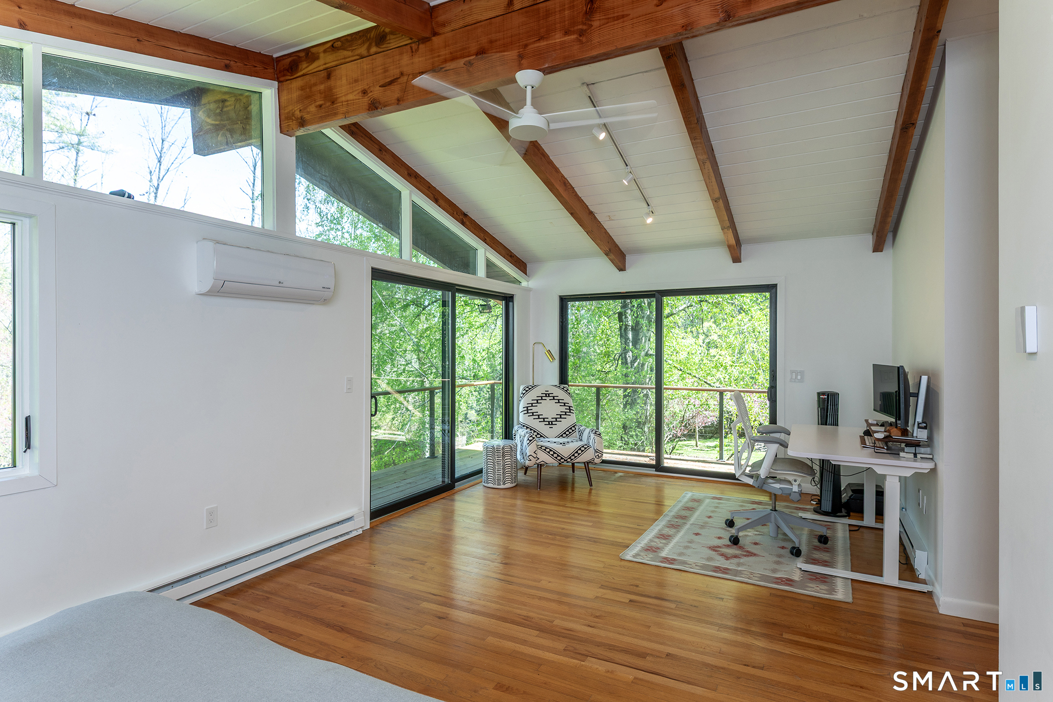 94 Washinee Heights Road Salisbury, CT 06068 - Photo 27 of 38 a living room with furniture floor to ceiling window and wooden floor