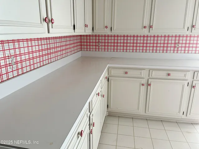 a view of a door and a wooden floor