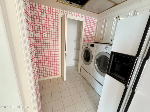 a view of an empty room with windows