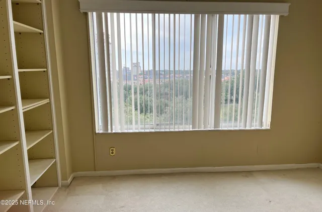 a spacious bathroom with a double vanity sink a mirror and a bathtub