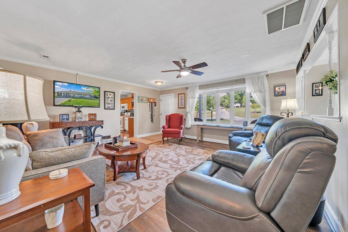 3226 Rakes Road Rocky Mount, VA 24151 - Photo 9 of 74 a living room with furniture or couch and a window