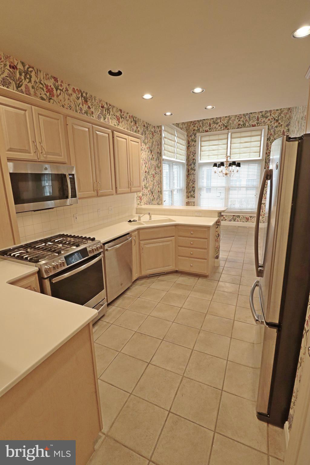 617 Northfield Road Lititz, PA 17543 - Photo 22 of 44 a kitchen with stainless steel appliances a stove a sink and a refrigerator