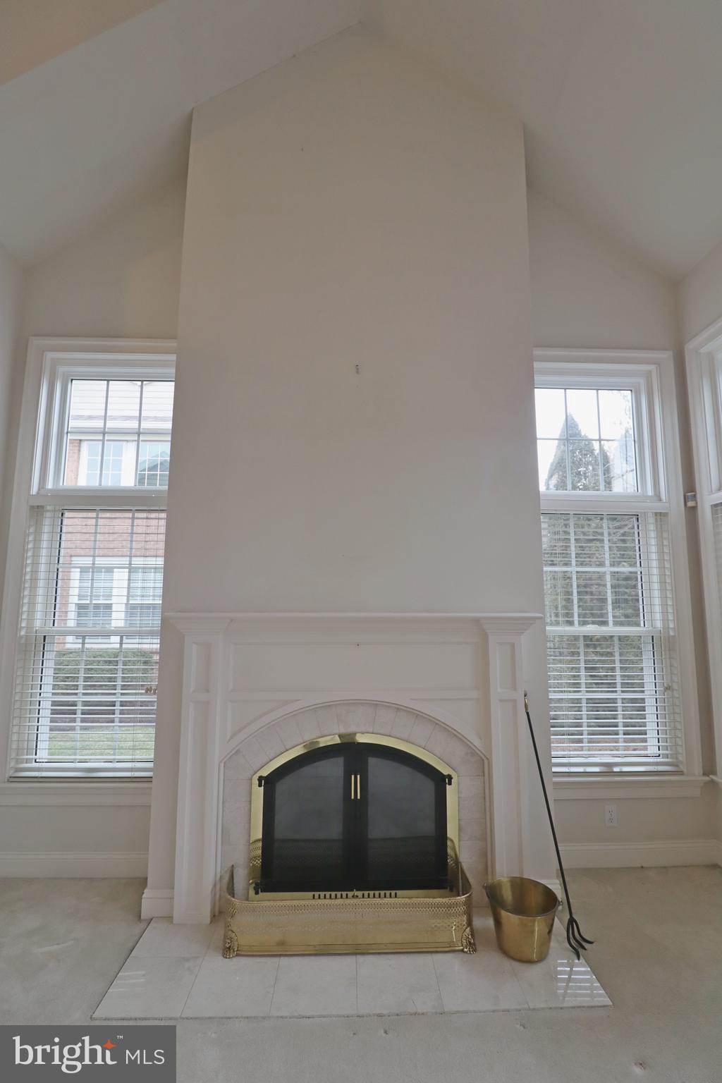 617 Northfield Road Lititz, PA 17543 - Photo 33 of 44 a living room with a fireplace and windows