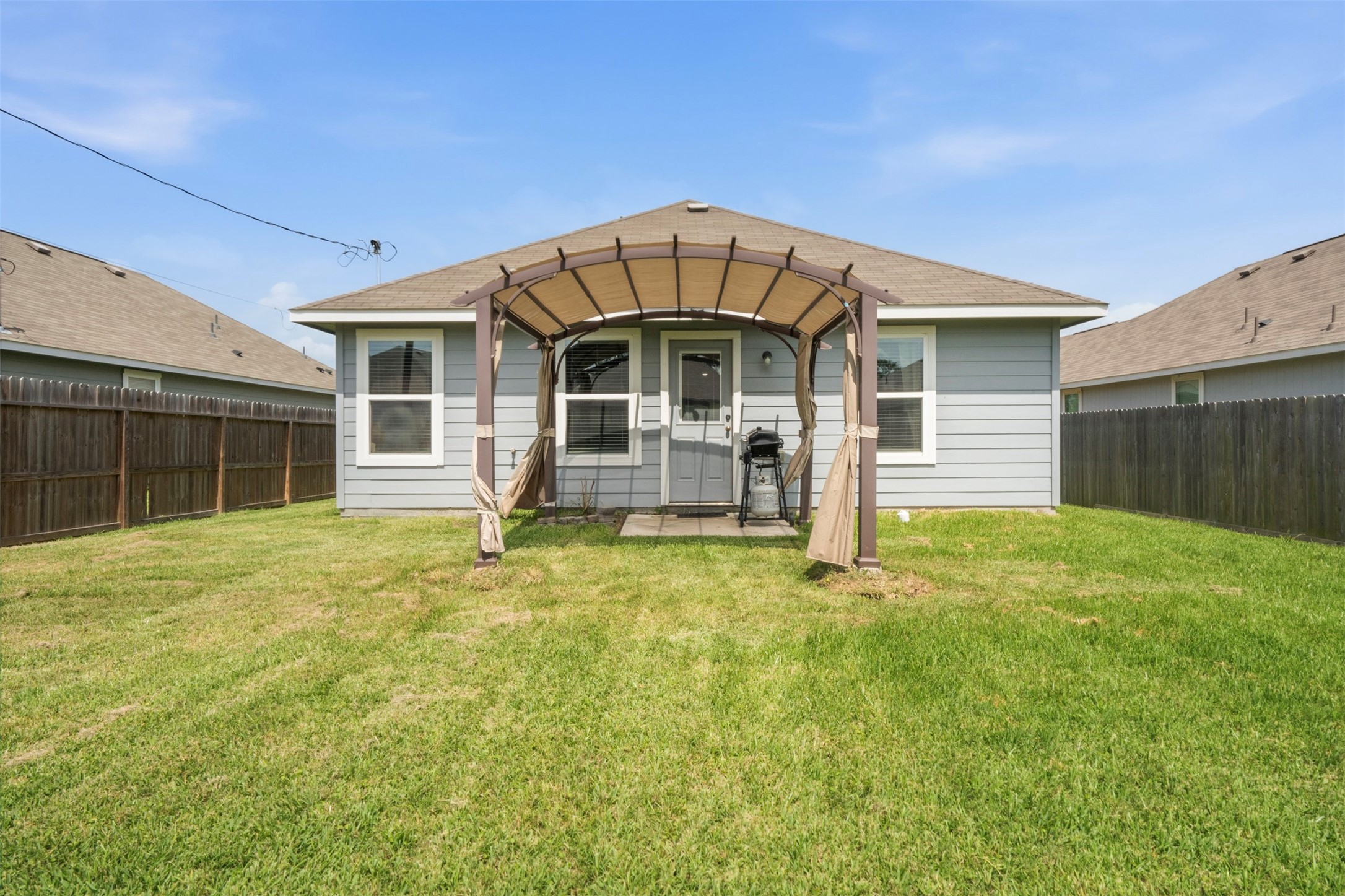 1523 22nd Street Hempstead, TX 77445 - Photo 20 of 26 Covered back patio overlooking the fully fenced backyard.