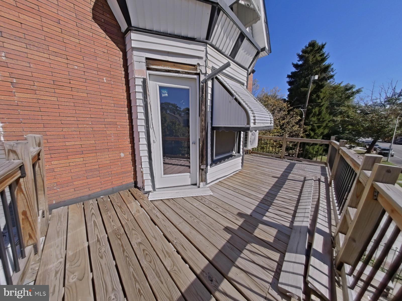 5331 Wayne Avenue Philadelphia, PA 19144 - Photo 21 of 53 a view of backyard with deck and wooden floor