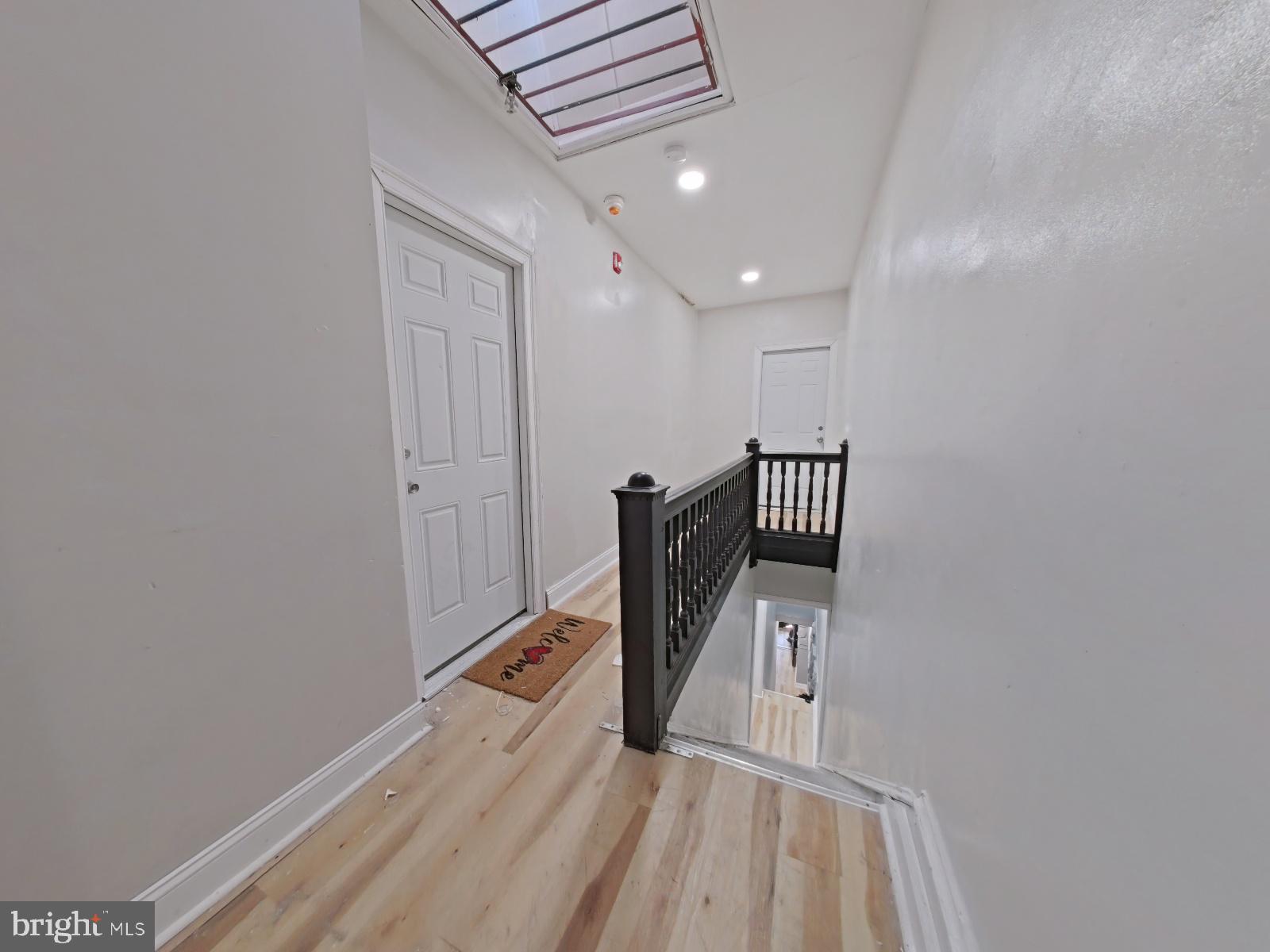5331 Wayne Avenue Philadelphia, PA 19144 - Photo 35 of 53 a view of a hallway with wooden floor and staircase