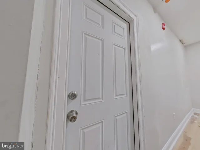 a living room with furniture window and a wooden floor