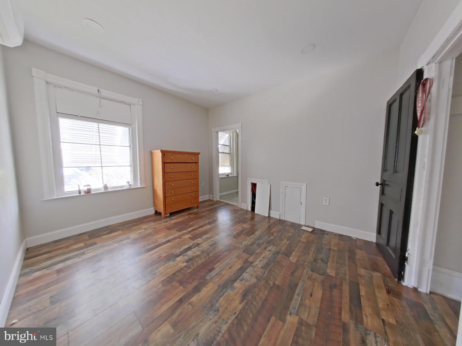 5331 Wayne Avenue Philadelphia, PA 19144 - Photo 41 of 53 a view of empty room with wooden floor and window