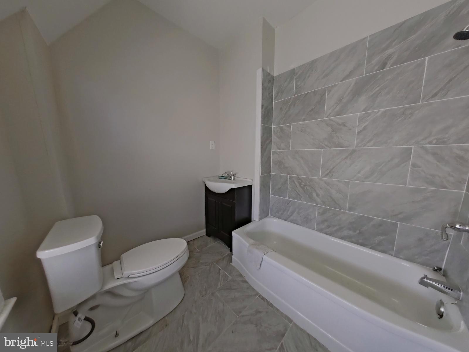 5331 Wayne Avenue Philadelphia, PA 19144 - Photo 43 of 53 a white toilet sitting next to a bath tub