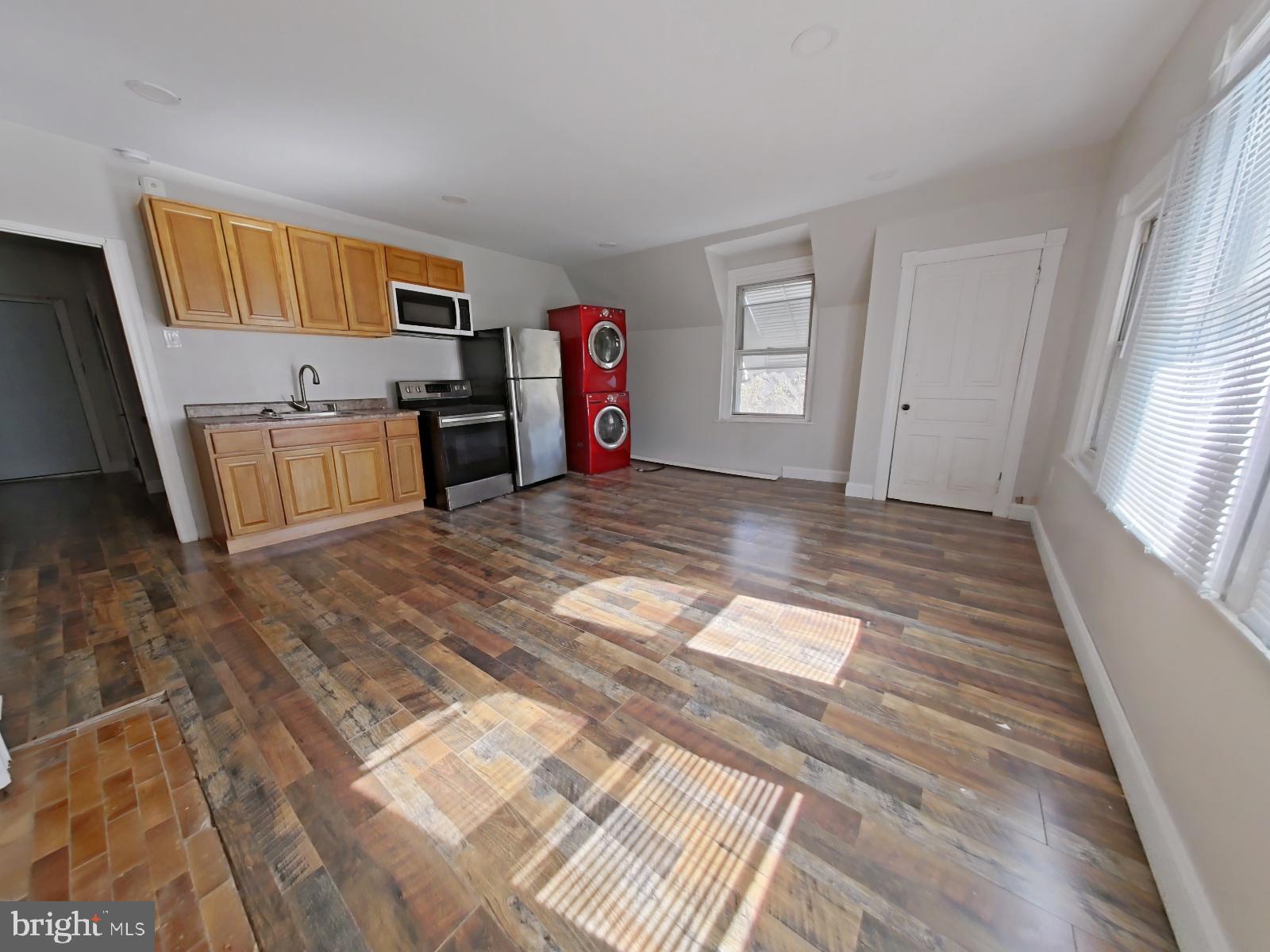 5331 Wayne Avenue Philadelphia, PA 19144 - Photo 48 of 53 a view of a kitchen with fridge and window