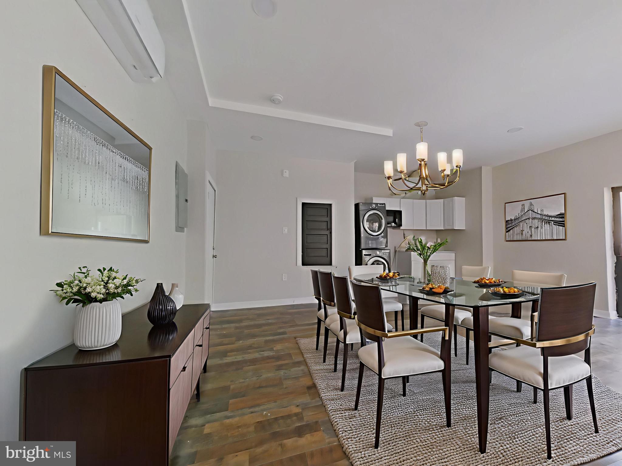 5331 Wayne Avenue Philadelphia, PA 19144 - Photo 5 of 53 a dining room with furniture a chandelier and wooden floor
