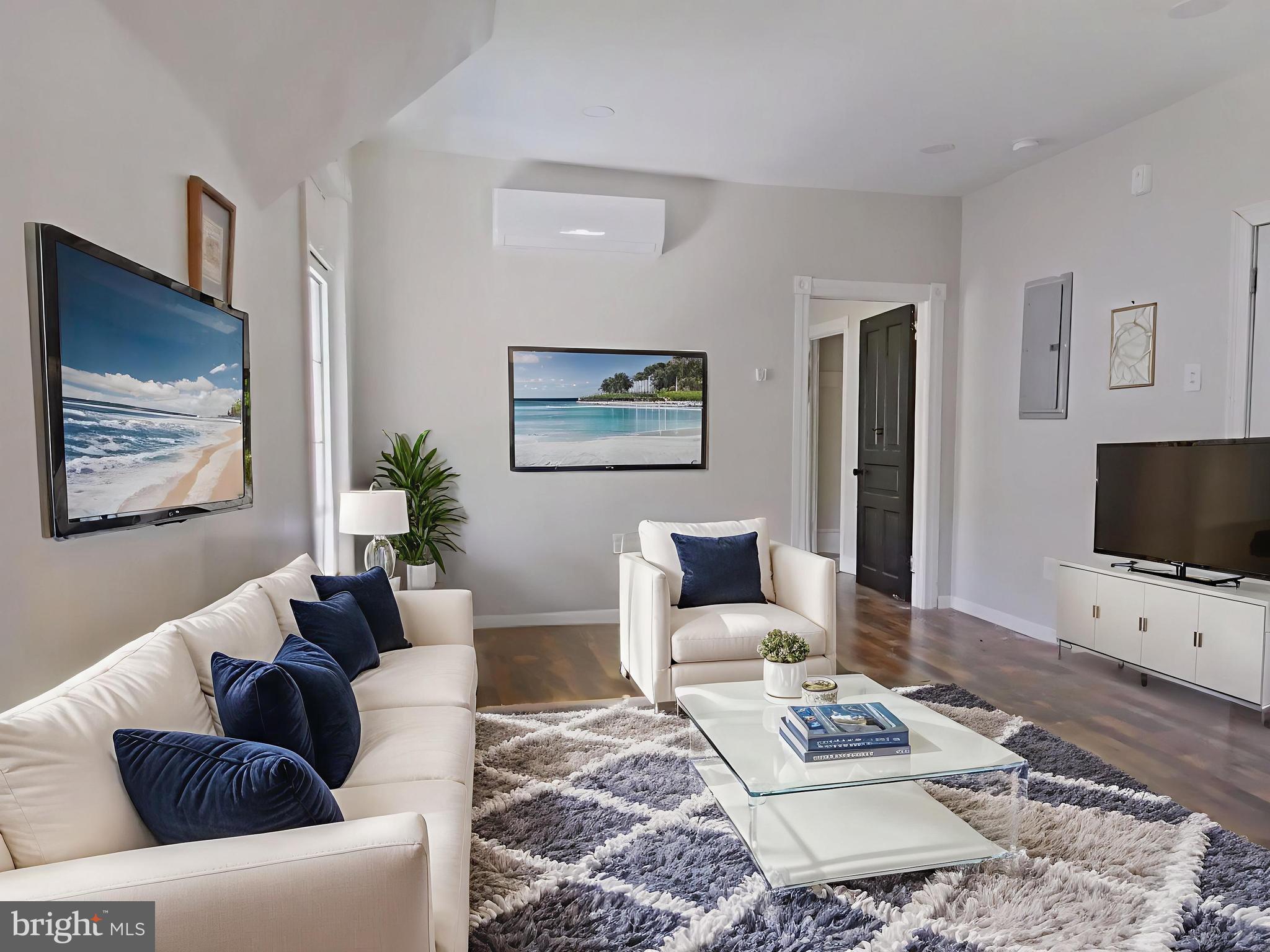 5331 Wayne Avenue Philadelphia, PA 19144 - Photo 6 of 53 a living room with furniture a rug and a flat screen tv