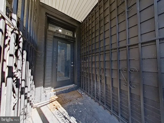a view of a wooden door and outdoor space