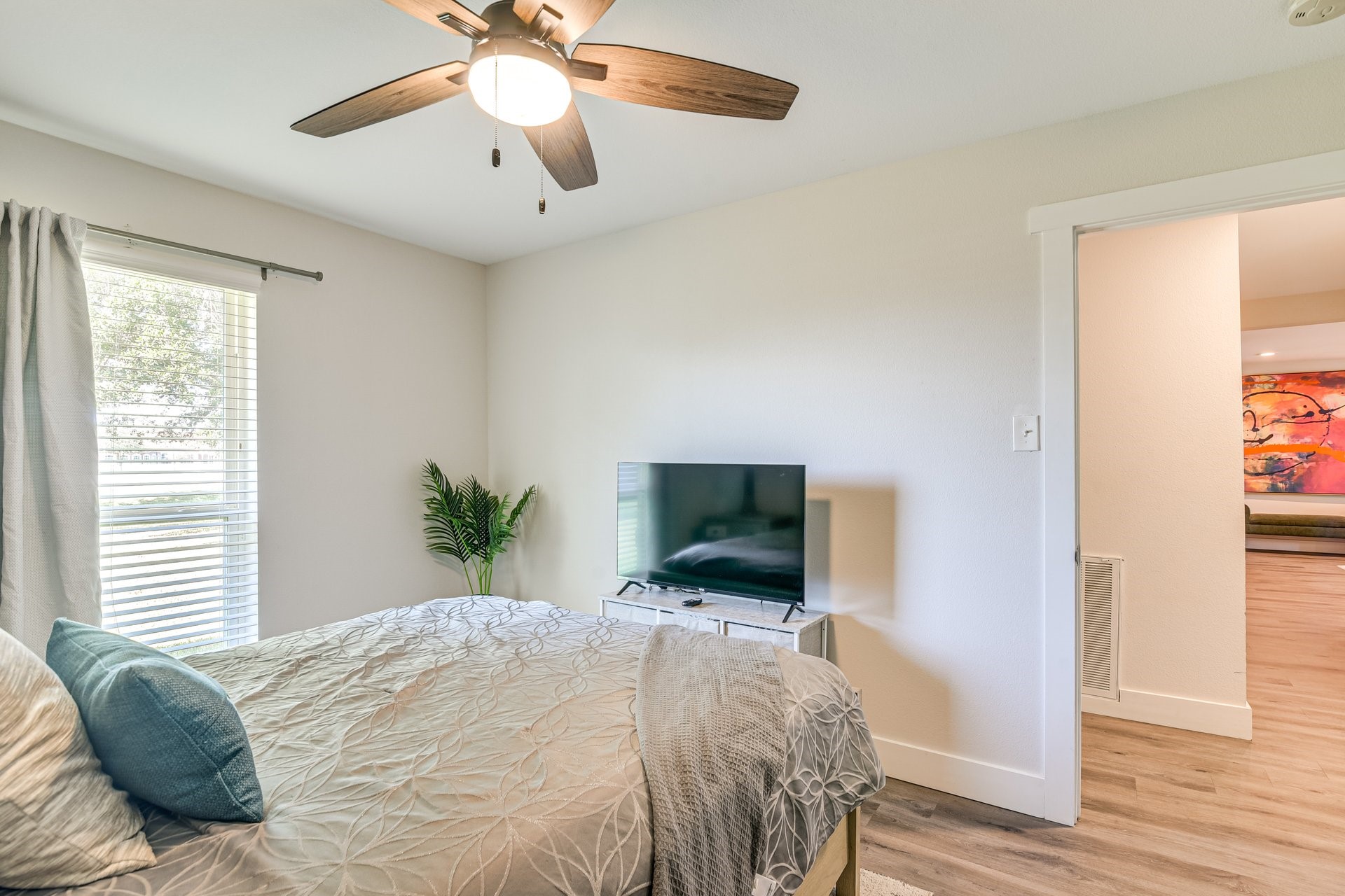 7003 McCoy Road Manvel, TX 77578 - Photo 13 of 27 a bedroom with a bed and a flat screen tv