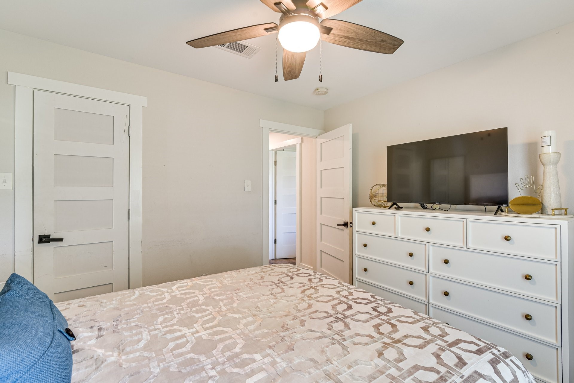 7003 McCoy Road Manvel, TX 77578 - Photo 17 of 27 a bedroom with a bed and a flat screen tv in it