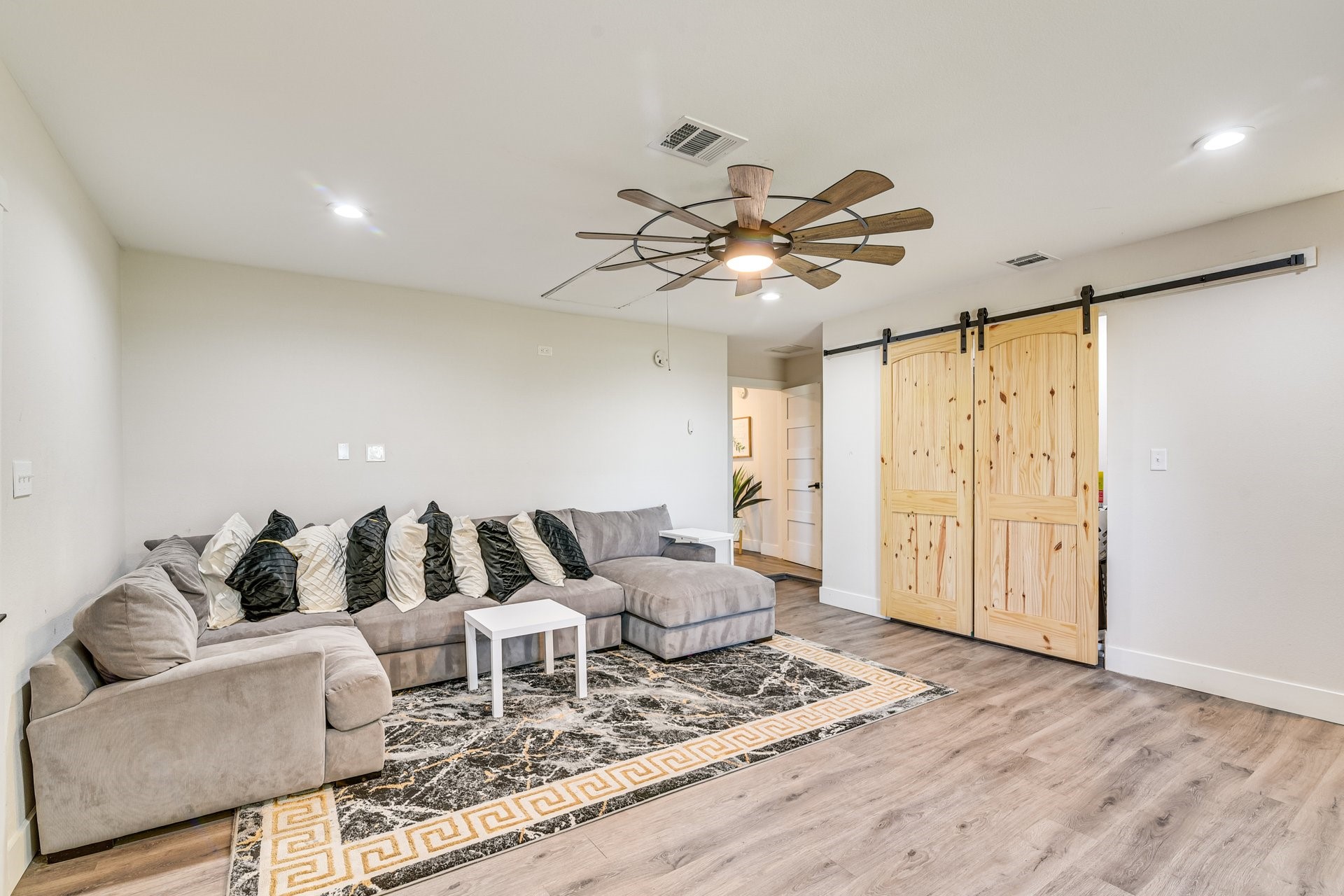 7003 McCoy Road Manvel, TX 77578 - Photo 25 of 27 a living room with furniture and wooden floor