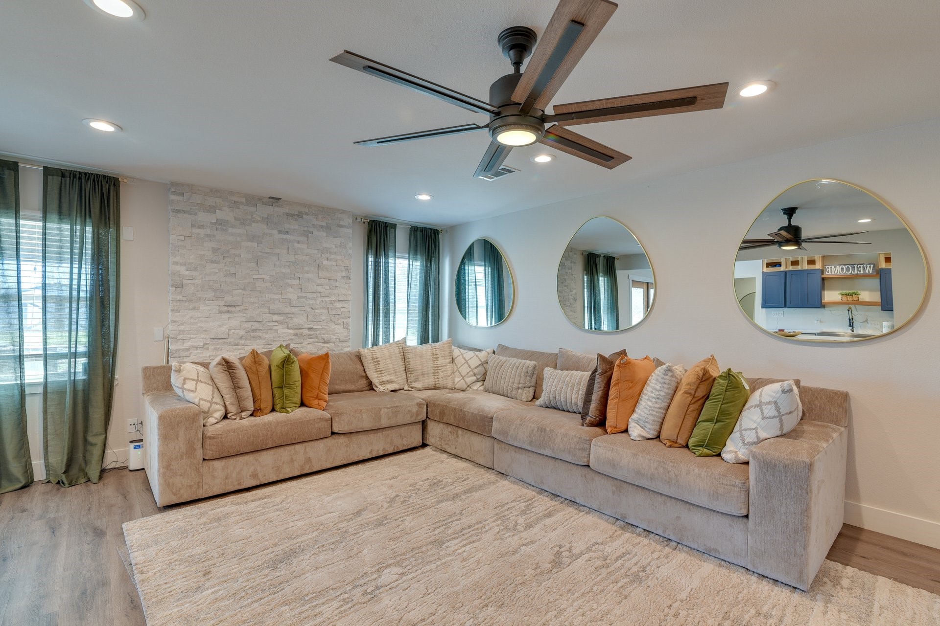 7003 McCoy Road Manvel, TX 77578 - Photo 3 of 27 a living room with couches and a ceiling fan