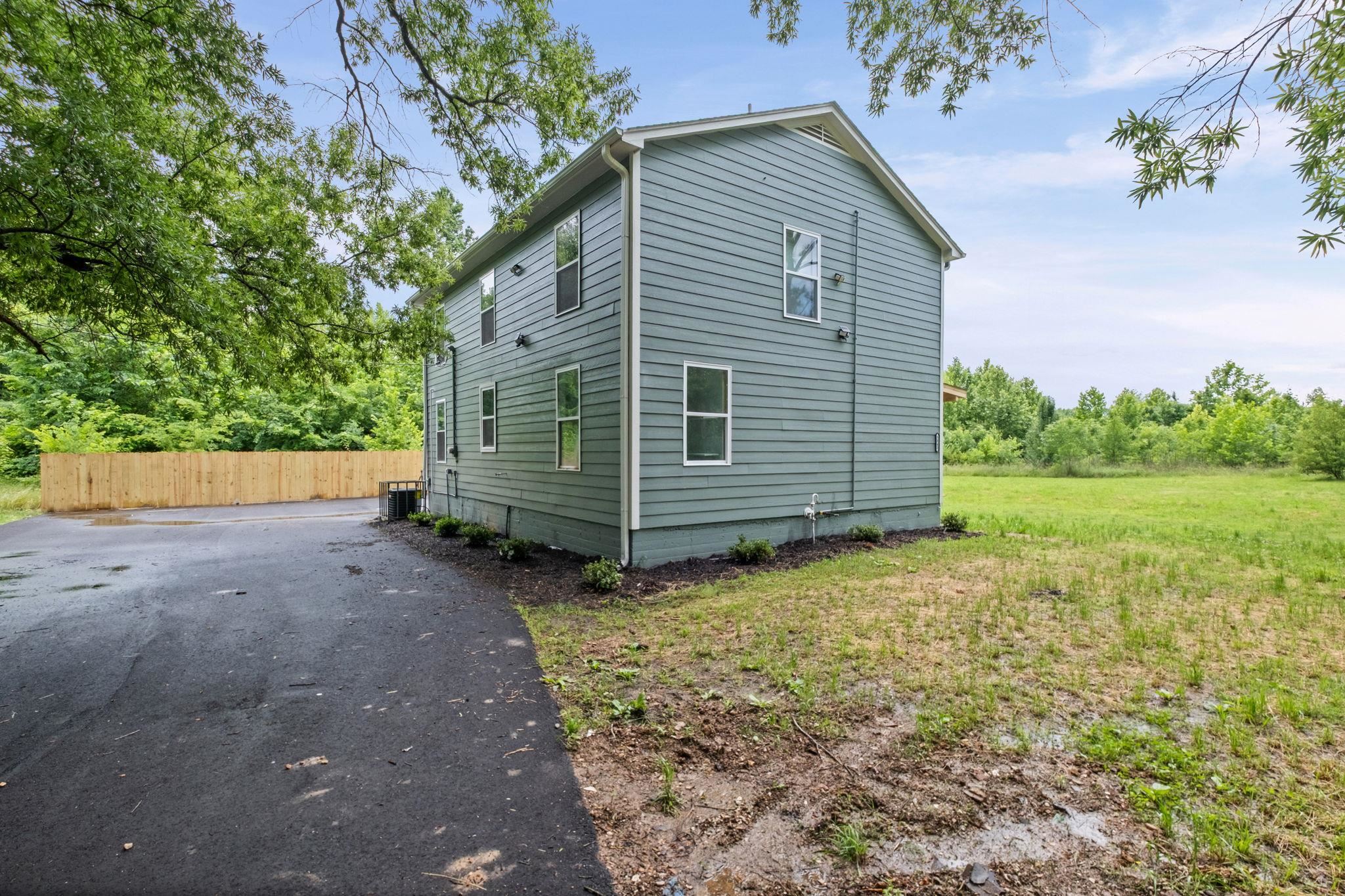5843 Stewart Road Lakeland, TN 38002 - Photo 6 of 26 Two-story residence featuring horizontal siding and multiple windows