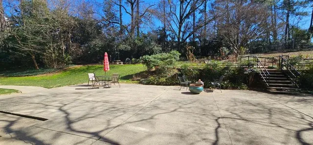 a view of a park with large trees