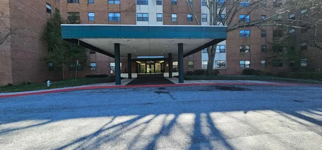 a view of a building with a yard