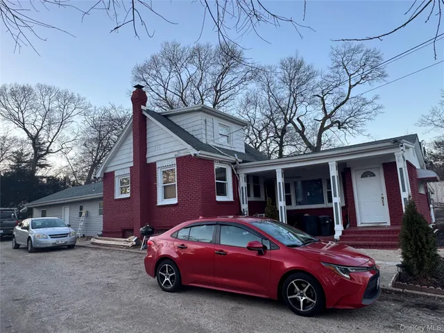 a car parked in front of a house