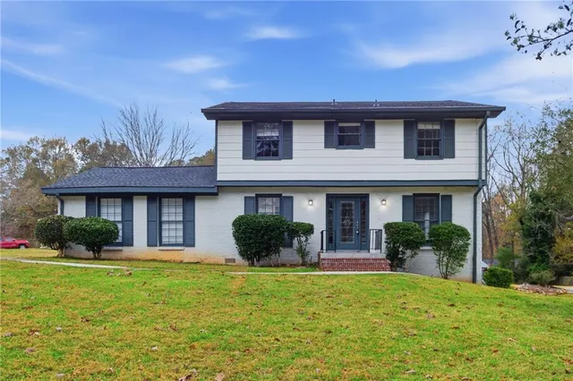 a front view of a house with garden