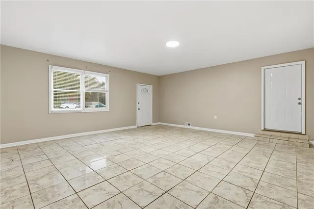 a view of an empty room and window