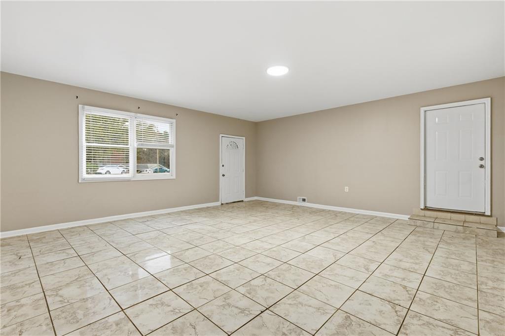 127 Old Rosser Road Lilburn, GA 30047 - Photo 12 of 34 a view of an empty room and window