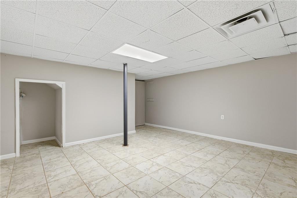 127 Old Rosser Road Lilburn, GA 30047 - Photo 19 of 34 an empty room with windows