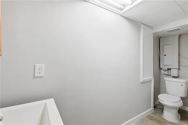 a bathroom with a toilet and a sink