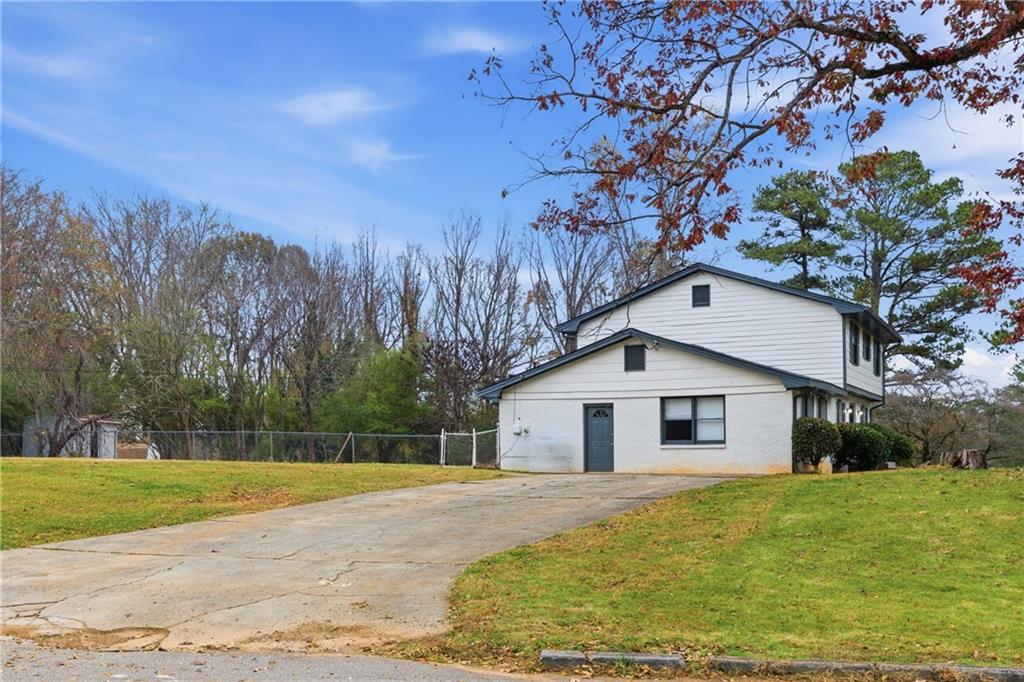 127 Old Rosser Road Lilburn, GA 30047 - Photo 23 of 34 a view of a house with a backyard