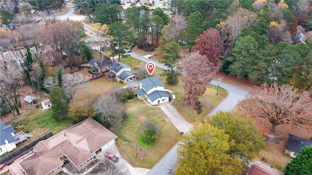 an aerial view of residential houses with outdoor space