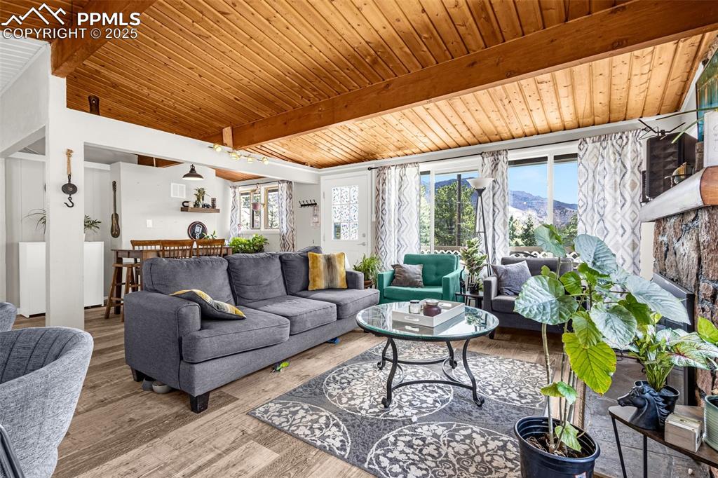 9515 Mountain Road Cascade, CO 80809 - Photo 12 of 34 a living room with patio furniture and a potted plant