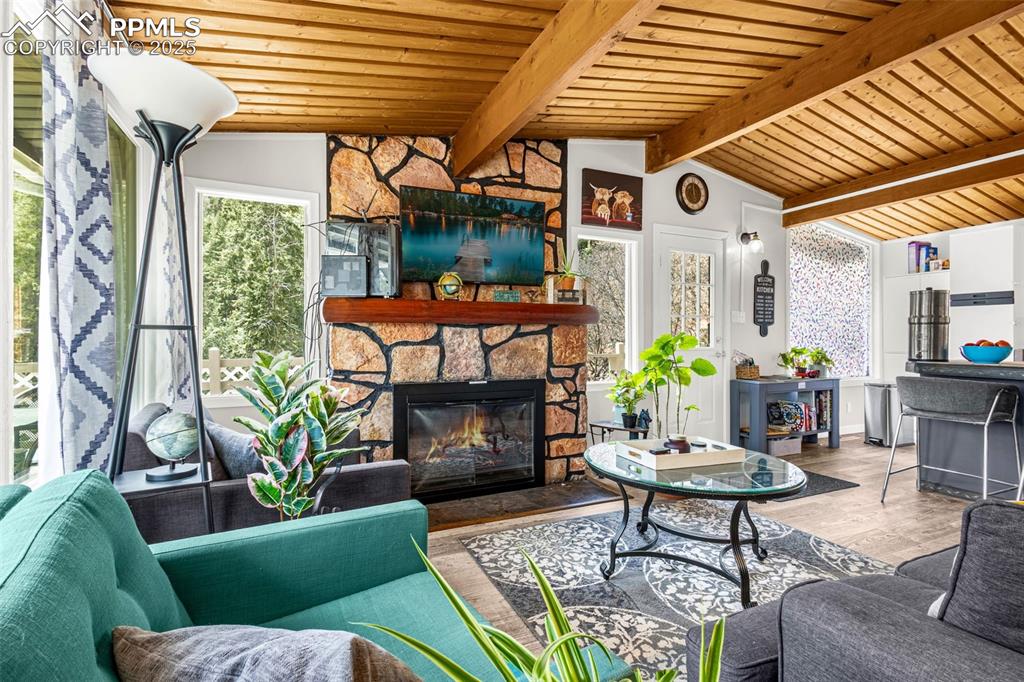 9515 Mountain Road Cascade, CO 80809 - Photo 18 of 34 a outdoor living space with patio furniture and a fireplace