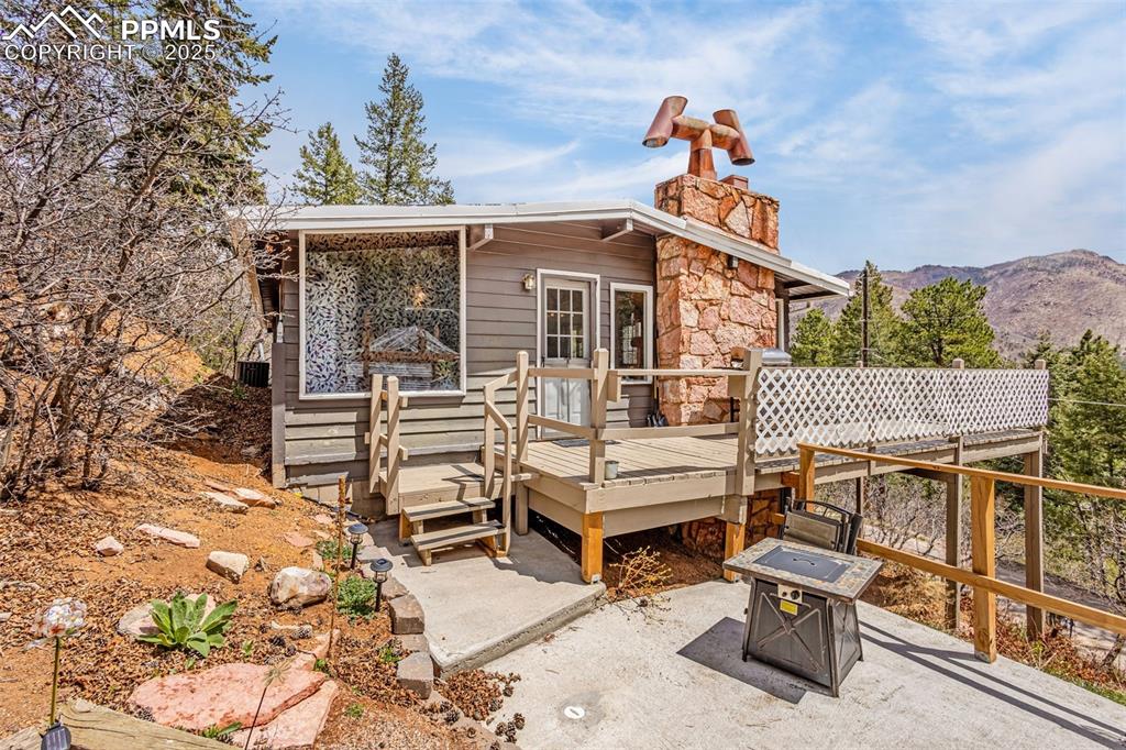9515 Mountain Road Cascade, CO 80809 - Photo 3 of 34 front view of a house with a balcony
