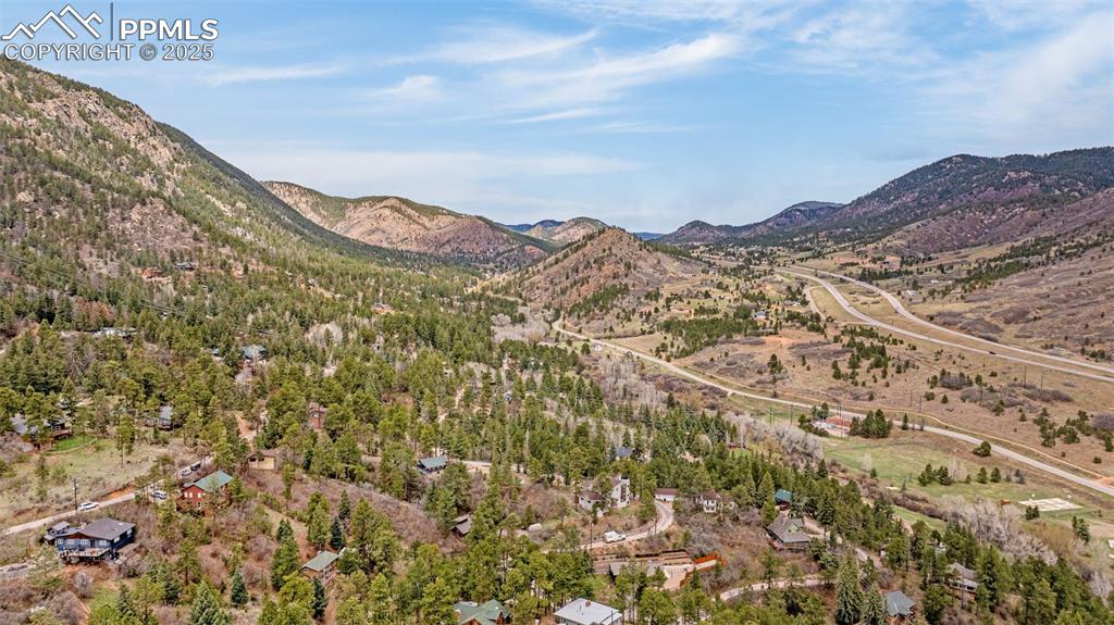 9515 Mountain Road Cascade, CO 80809 - Photo 33 of 34 a view of a large building with a mountain in the background