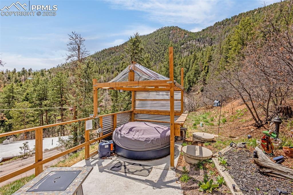 9515 Mountain Road Cascade, CO 80809 - Photo 10 of 34 a view of a house with a iron gate