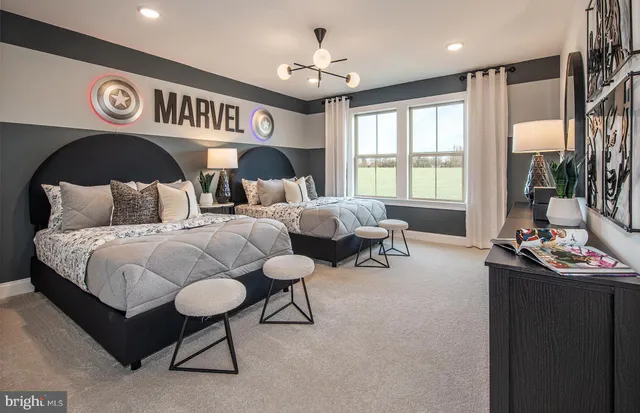 a theatre with furniture and a chandelier