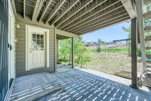 a view of a balcony with wooden floor