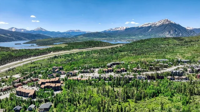 a front view of a house with a yard and balcony