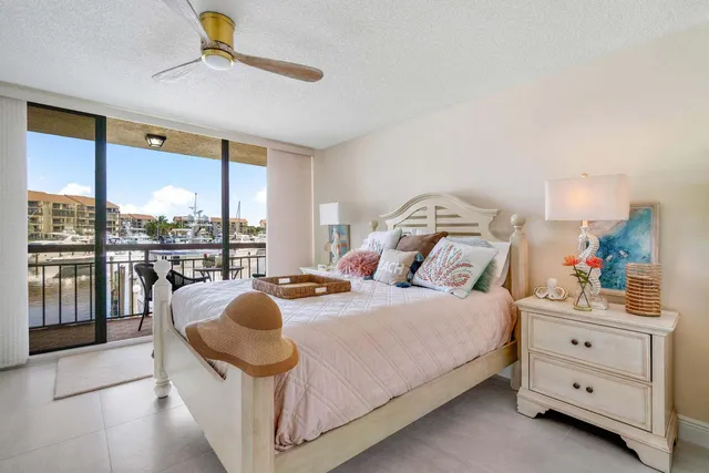 a bedroom with a bed and a lamp