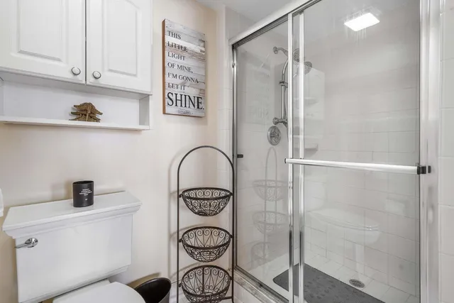 a view of walk in closet with clothes