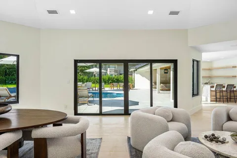 a bedroom with a bed and a mirror