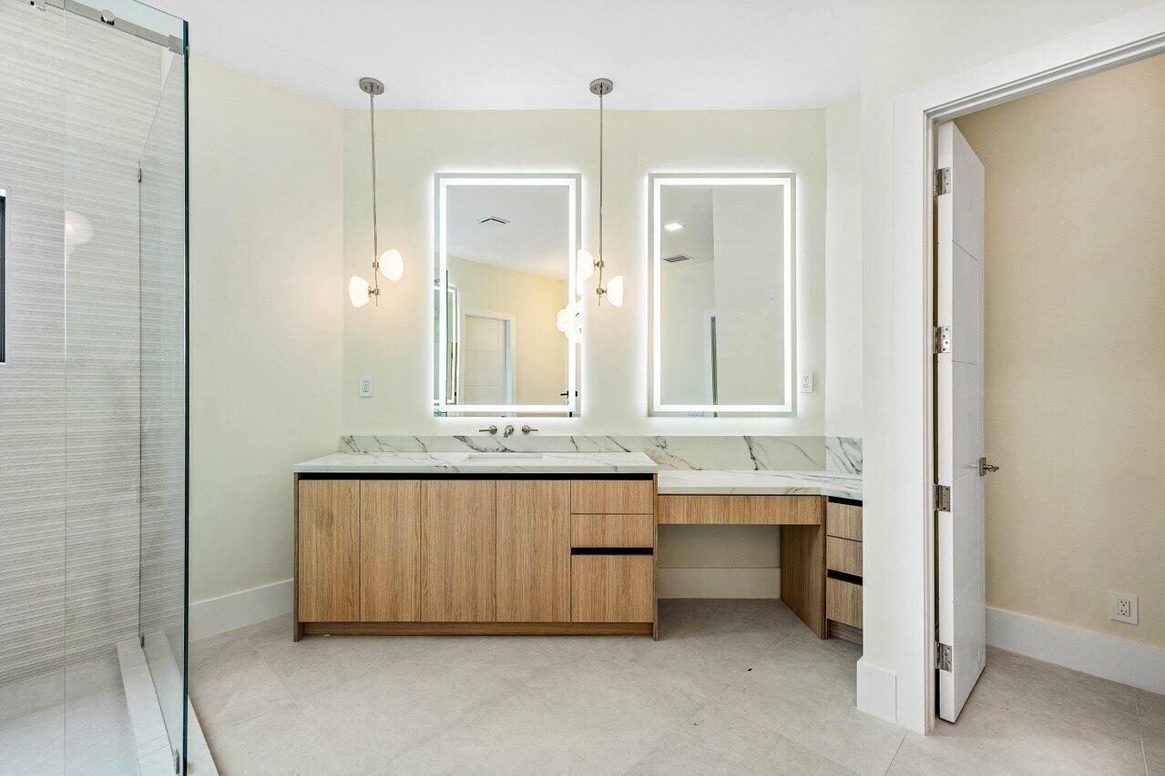 8090 Twin Lake Drive Boca Raton, FL 33496 - Photo 38 of 56 a bathroom with a double vanity sink mirror and double