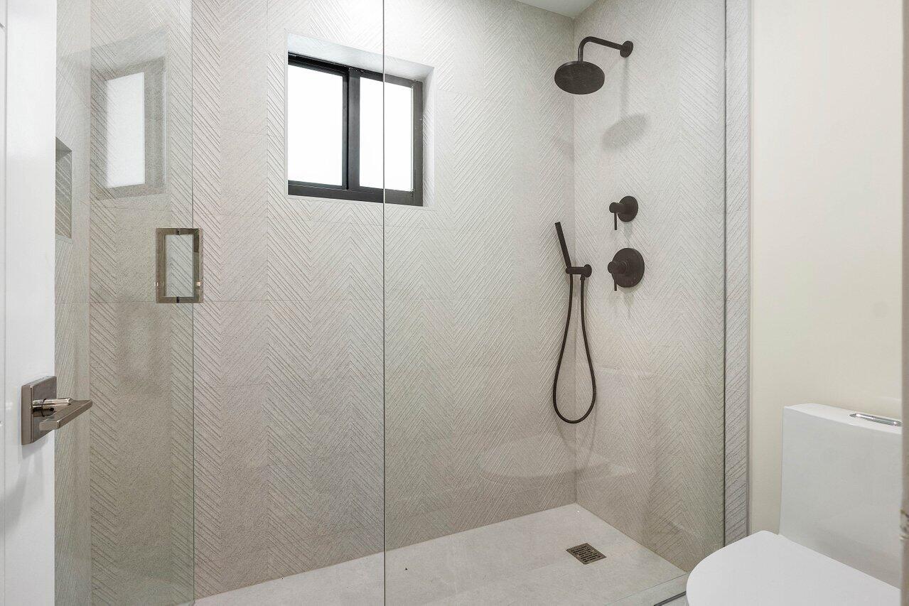 8090 Twin Lake Drive Boca Raton, FL 33496 - Photo 44 of 56 a bathroom with a shower
