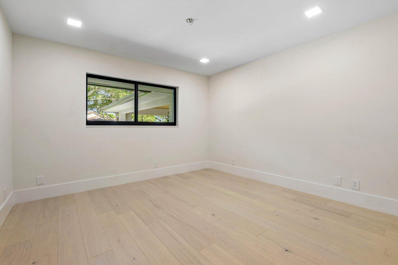 8090 Twin Lake Drive Boca Raton, FL 33496 - Photo 45 of 56 an empty room with windows