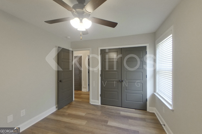 154 Allentown Way Macon, GA 31216 - Photo 15 of 21 wooden floor in an empty room with a window